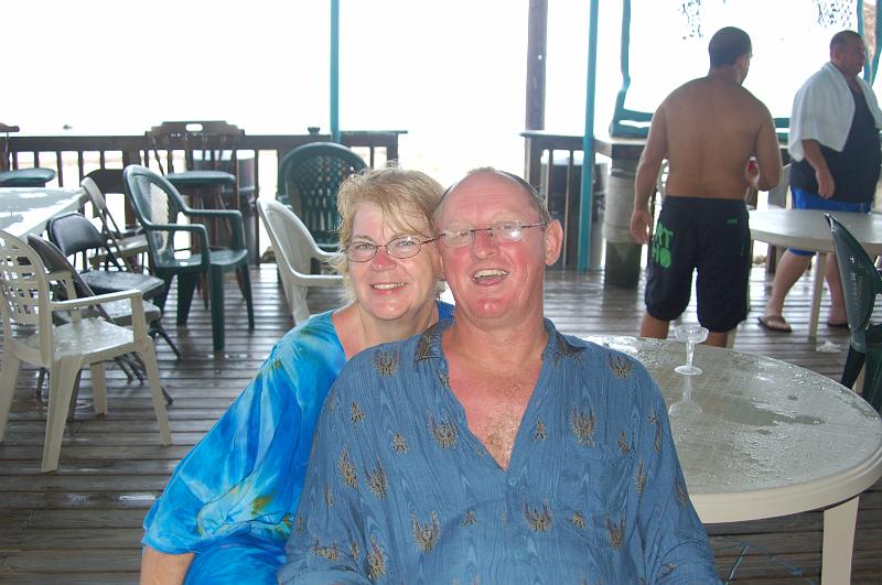 DSC_9416.JPG - Florida Keys - Mark and Deb under cover in a big rain storm...