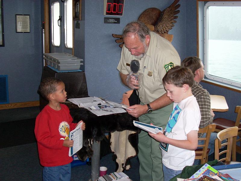 27.JPG - Octavious and another boy on the cruise are sworn in as Junior Rangers, Chugach National Forest, Alaska