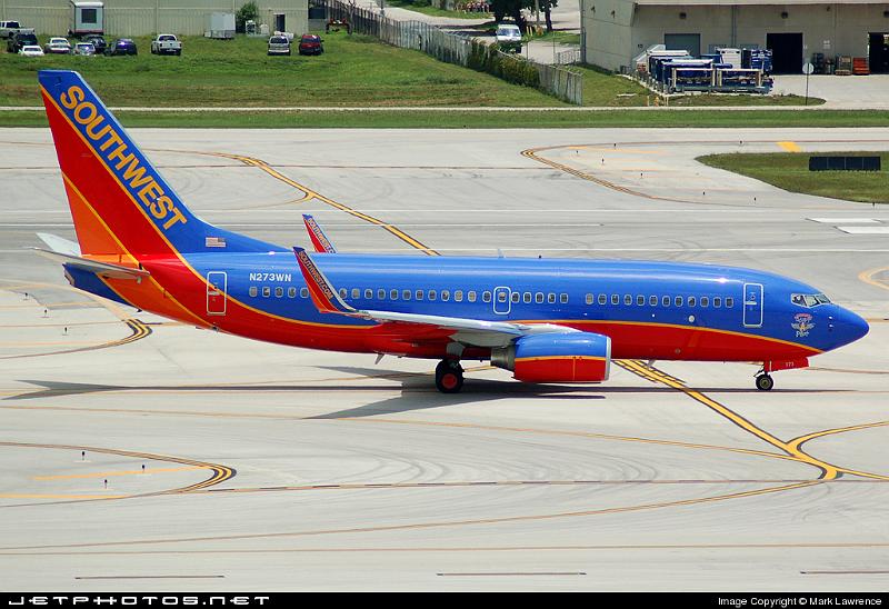 45475_1184265486.jpg - Southwest B737-700 Adopt-A-Pilot taxiing into parking at Ft Lauderdale International