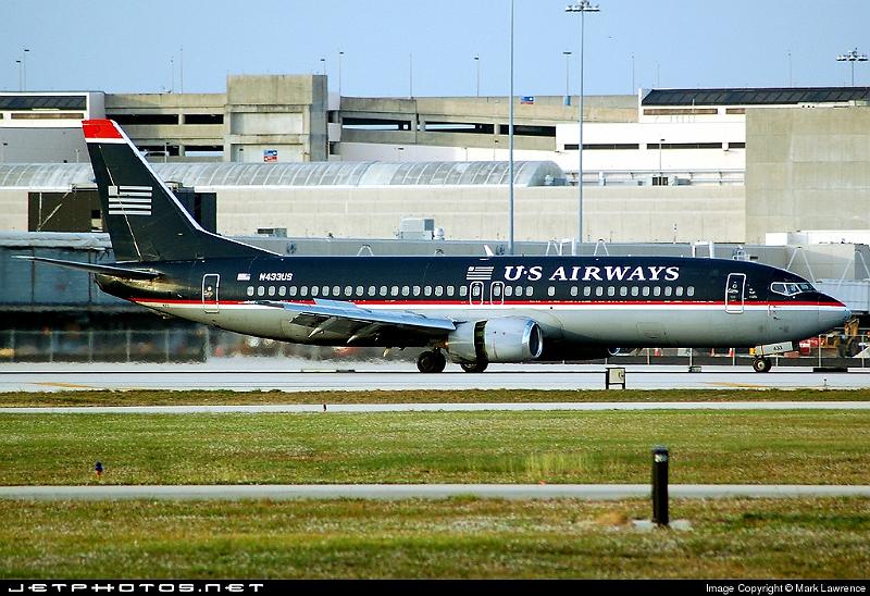 46633_1165226368.jpg - US Airways B737-400 slowing down on runway 9L at Palm Beach International